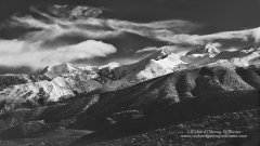 Black and white photo of snow capped mountains in southern Greece