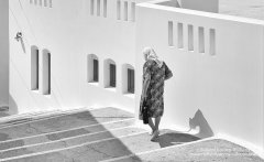 Graphic photo of lady on stairs in Greece