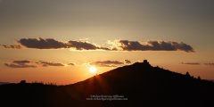 Sunset showing the silhouette of Haravgi Castle in the Peloponnese of Greece
