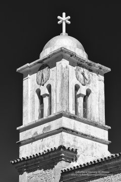 Black and white photograph studying the architecture of a church tower 