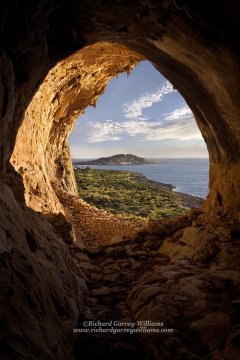 View of Mani coastline landscape from inside cave