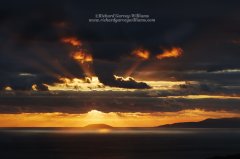 Minimalist photographic image of a dramatic sky over Venetico Island in Greece