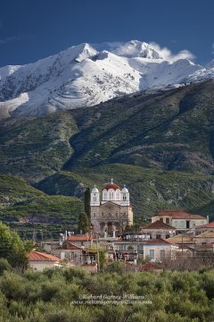 Kambos village with the dramatic backdrop of the snow capped Tygetos mountains