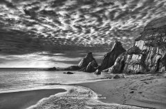 Dramatic black and white coastal landscape photograph of Devon coast